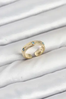 Pirinç Gold Renk Mavi Zirkon Taşlı Kutup Yıldızı Model Kadın Yüzük